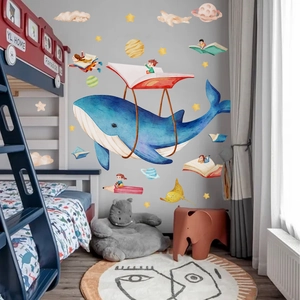 Nursery wall decals featuring a large watercolor blue whale and whimsical dream theme
