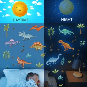 Luminous dinosaur wall stickers set showing daytime colors and night glow effect in bedroom