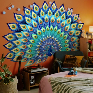 Detailed view of a large colorful peacock wall decal on an orange living room background