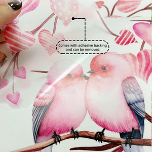Detail showing self-adhesive backing of heart tree wall decal with pink birds