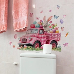 Close-up of Easter wall stickers with pink vintage truck and bunnies on white tile