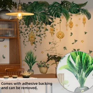 Detail view of tropical monstera leaves and star lanterns wall decal with adhesive texture