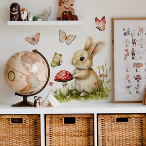 Detail of Easter watercolor bunny, mushroom and butterfly wall stickers in a nursery decor