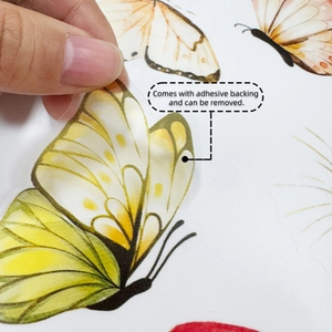 Detail of peeling yellow butterfly adhesive sticker showing easy removal feature