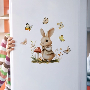 Detail of Easter bunny and butterfly stickers applied to a smooth white surface