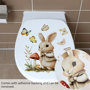 Detail of adhesive Easter bunny and butterfly stickers on a bathroom toilet lid