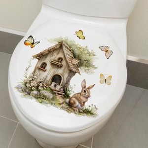 Detailed toilet lid decal featuring bunnies, forest cabin and daisies in watercolor style