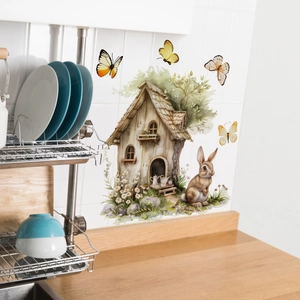 Detailed view of watercolor bunny and treehouse wall stickers in a kitchen scene