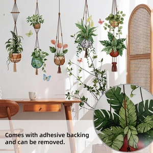 Detail of self-adhesive wall decals featuring hanging green plants and butterflies