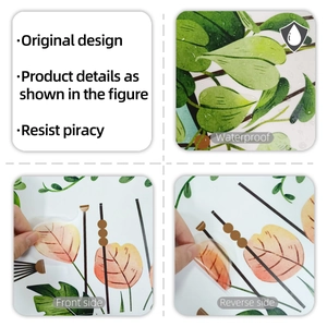 Macro shot of waterproof PVC tropical plant wall decals showing front and reverse side texture