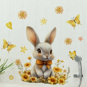 Detail of Easter rabbit wall sticker with yellow butterflies and flowers on bathroom tiles