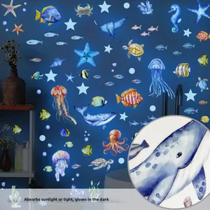 Luminous ocean creature wall stickers showing whale and jellyfish details in dark