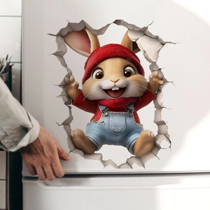 Close-up of 3D cartoon bunny sticker with red hat breaking through white surface