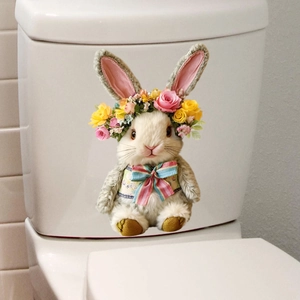 Close-up of Easter bunny toilet sticker with flower crown on a white bathroom tank
