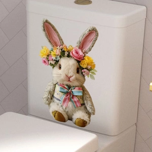 Detailed view of Easter bunny wall sticker with flower crown and plaid bow on toilet tank