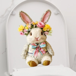 Detail of Easter bunny toilet sticker with flower crown and blue bow on white lid