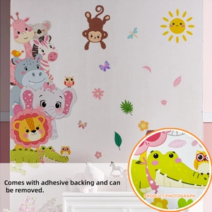 Detail of self-adhesive animal wall decals featuring giraffes, lions, and elephants