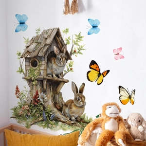 Easter wall decal detail showing realistic brown rabbits and a wooden treehouse sticker