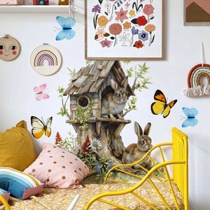 Detail of artistic Easter bunny treehouse wall stickers in a cozy nursery room setting