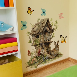 Detailed view of watercolor Easter rabbit and forest house wall stickers on home wall
