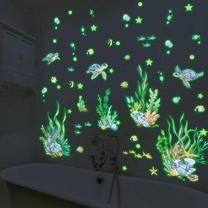 Luminous marine sea turtle and fish wall stickers glowing in dark bathroom setting
