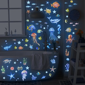 Glow-in-the-dark ocean world wall stickers featuring fish, turtles and stars for room decor