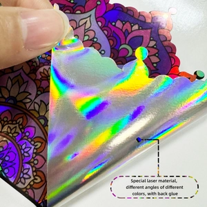 Detail view of holographic mandala sticker with adhesive backing and rainbow laser effect