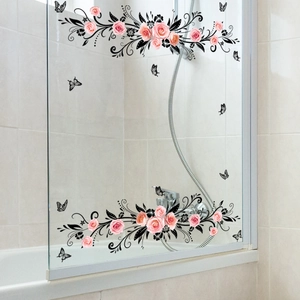 Pink roses and black vine stickers with butterflies on a glass bathroom door