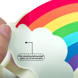 Close-up showing adhesive backing of luminous rainbow and cloud bathroom wall sticker