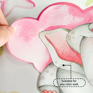 Detail of watercolor cloud and elephant wall stickers showing transparent edges on a wall