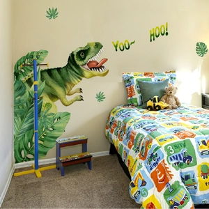 Detail of dinosaur wall stickers with a large green T-Rex and tropical leaves for kids rooms