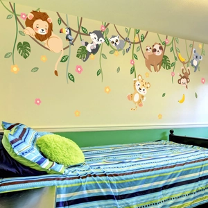 Detailed jungle animal wall decals set featuring cartoon lions and monkeys in a nursery room