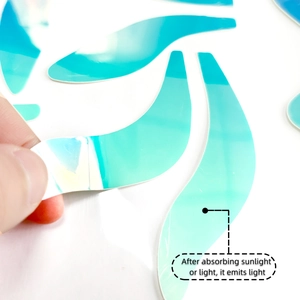 Glow-in-the-dark bunny ear wall sticker showing self-adhesive backing and thin texture
