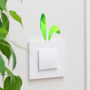 Close-up of green bunny ear luminous switch sticker for kids room wall decoration