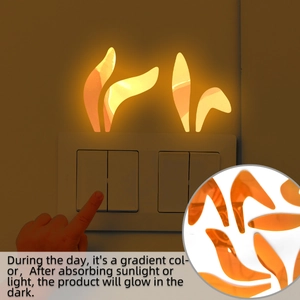 Glow-in-the-dark rabbit ear switch sticker showing daylight gradient and night luminosity