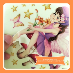 Glow-in-the-dark wall stickers with fairy and stars being peeled off from paper