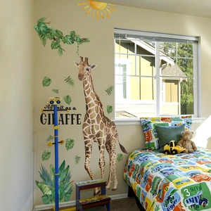 Cartoon giraffe and tropical leaves wall decal for kids room with As Tall As A Giraffe text