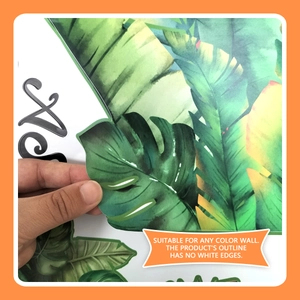 Detail of transparent borderless tropical leaf wall sticker showing peeling application
