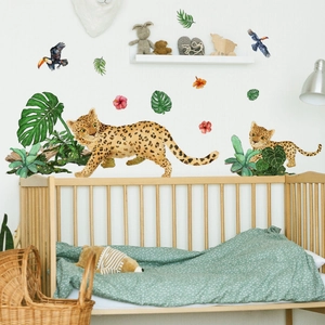 Tropical jungle wall decals featuring leopards, palm leaves, and toucans for a nursery room