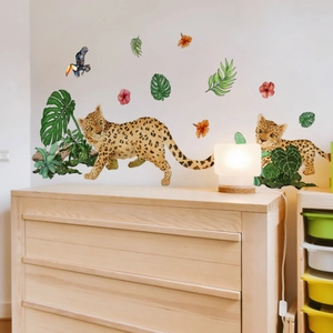 Detail of watercolor jungle wall stickers with leopards, toucans and tropical leaves