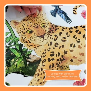 Detail showing adhesive leopard and floral wall sticker being peeled from backing