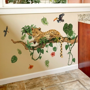 Detail of tropical rainforest wall stickers with leopard, toucans and lush green leaves