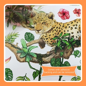 Detail of leopard wall sticker with monstera leaves and hibiscus flowers decor