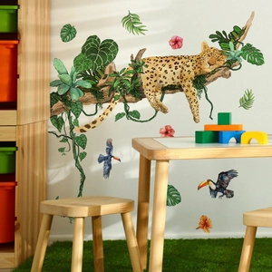 Detail of tropical jungle wall decals with leopard and leaves in children's room