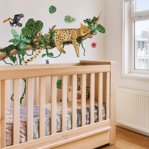 Nursery wall stickers with sleeping leopard, toucan, and tropical leaves in watercolor