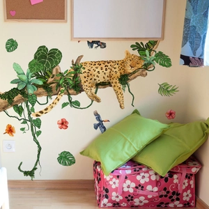 Detail showing hand-painted leopard and tropical monstera leaves wall sticker for kids room