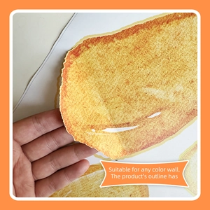 Detail showing self-adhesive toast bread wall sticker being peeled from backing paper