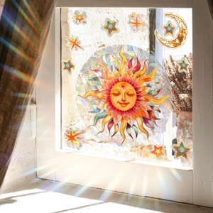 Rainbow prism sun and moon window static stickers casting colorful light on a home wall