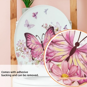 Detail von Blumenwandaufklebern mit rosa Schmetterlingen und Vögeln auf einem WC-Deckel