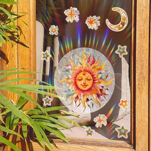 Rainbow effect detail of celestial sun moon and star window stickers on glass